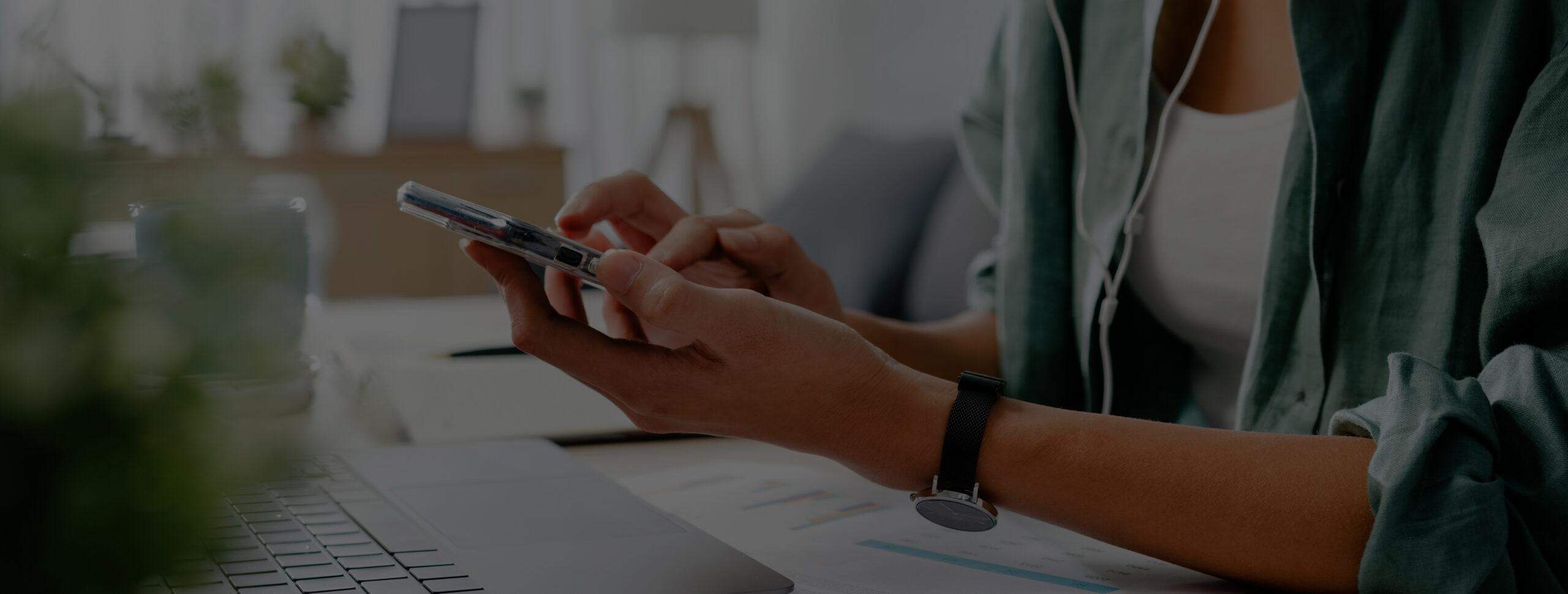 Freelancer Asia women wear face mask using smartphone shopping online via website while sitting at desk in living room. Working from home, remotely work, social distancing, quarantine for coronavirus.